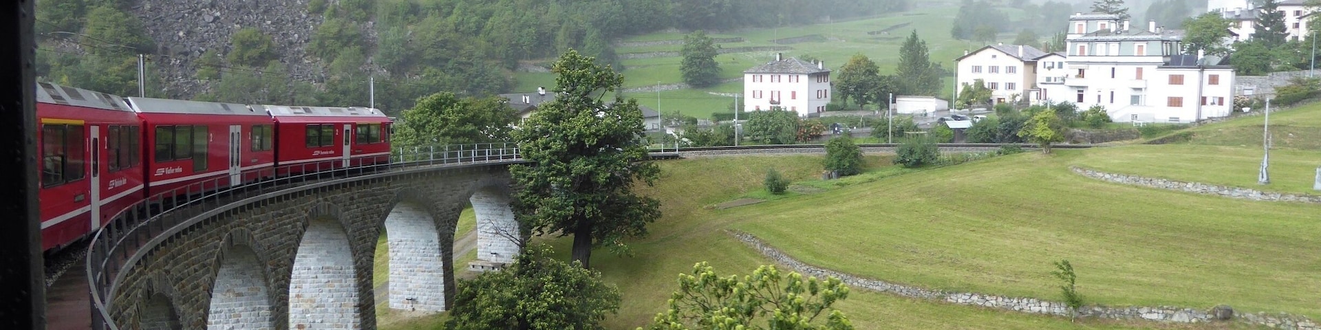 Bernina Express heading down the Brusio Circular Viaduct in Southern Switzerland.