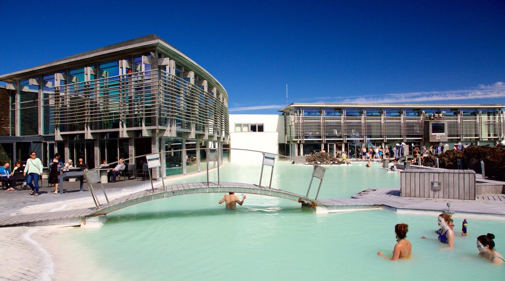 Grindavik featuring swimming and a pool as well as a small group of people
