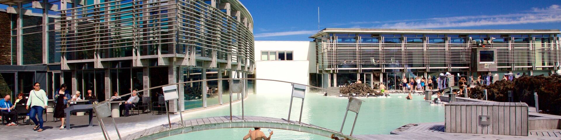 Grindavik featuring swimming and a pool as well as a small group of people