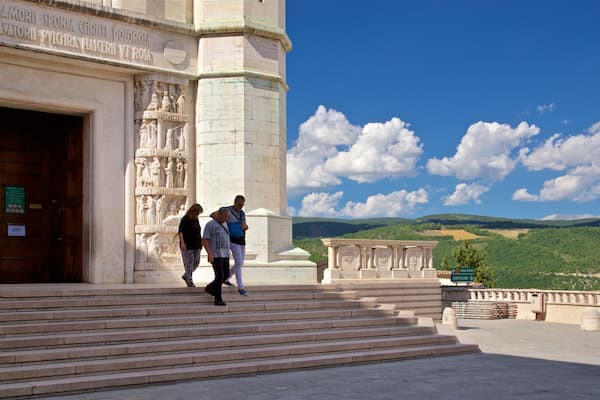 Basilica di Santa Rita which includes heritage elements and views as well as a small group of people