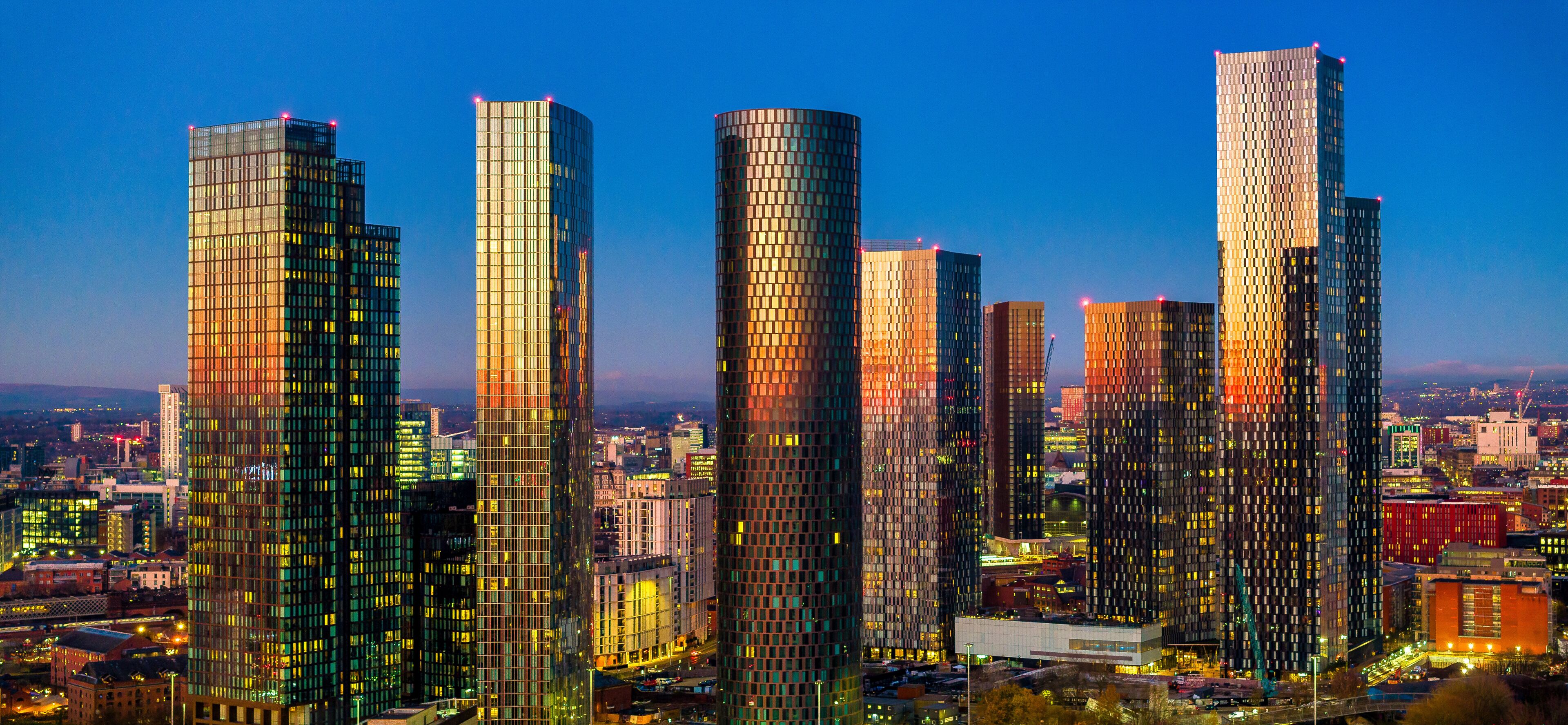Panoramic image Manchester city skyline touched by the golden color of the Sunset