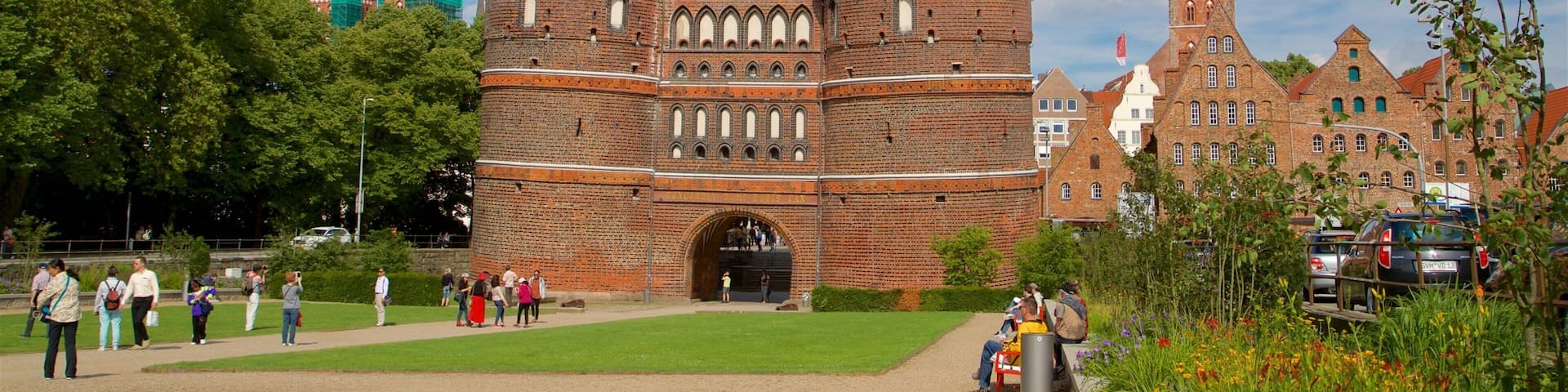 Museum Holstentor featuring wildflowers, a garden and heritage architecture