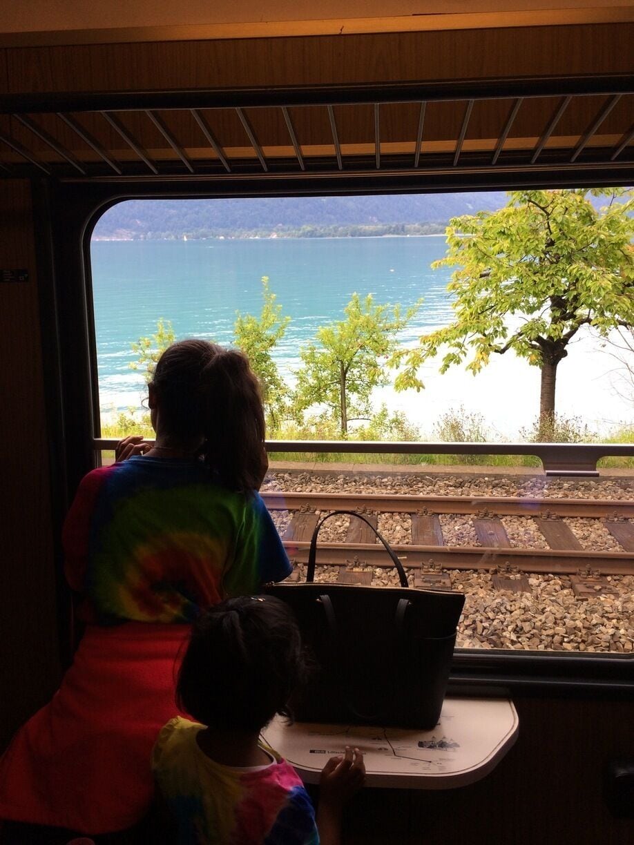 #troverdetour 

The Golden Panoramic Line that runs between Montreux and Interlaken stops at Darligen for a few minutes and we are wonder stuck as we stand there, rooted - the sea green waters of the Aare Lake, the green Swiss Alps in the background and cute Plum trees lining the beach! if there is a heaven on earth, it is here, it is here, it is here!!! 