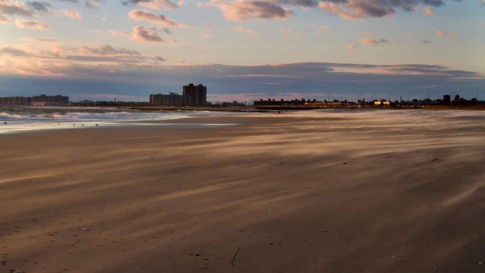 Empty Beach in Far Rockaway, New York. Sandy beach with cloudy Sky