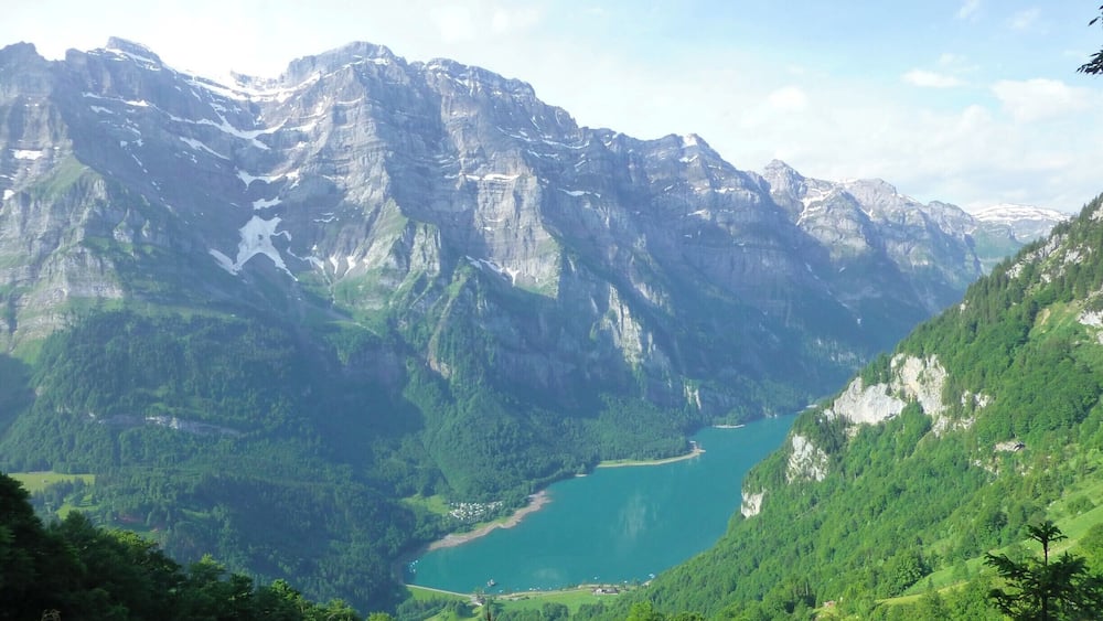 Beautiful lake situated between steep mountain ranges in the Swiss alps. Great place for hikes and swimming.