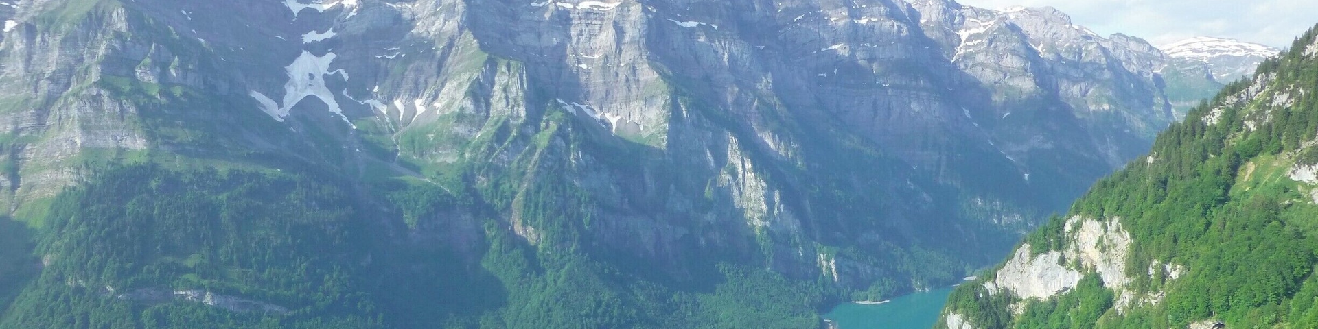 Beautiful lake situated between steep mountain ranges in the Swiss alps. Great place for hikes and swimming.