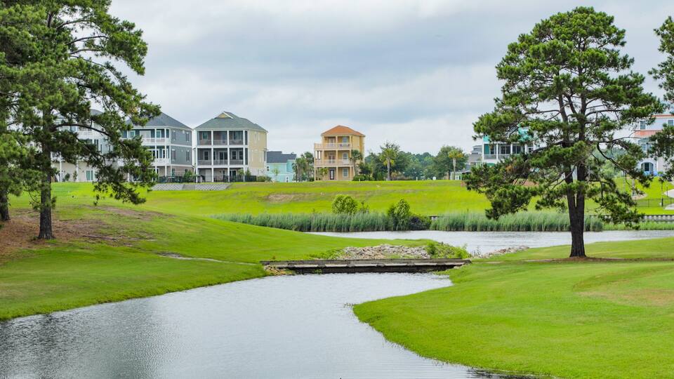 Myrtlewood Golf Club featuring golf and a river or creek