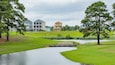 Myrtlewood Golf Club featuring golf and a river or creek