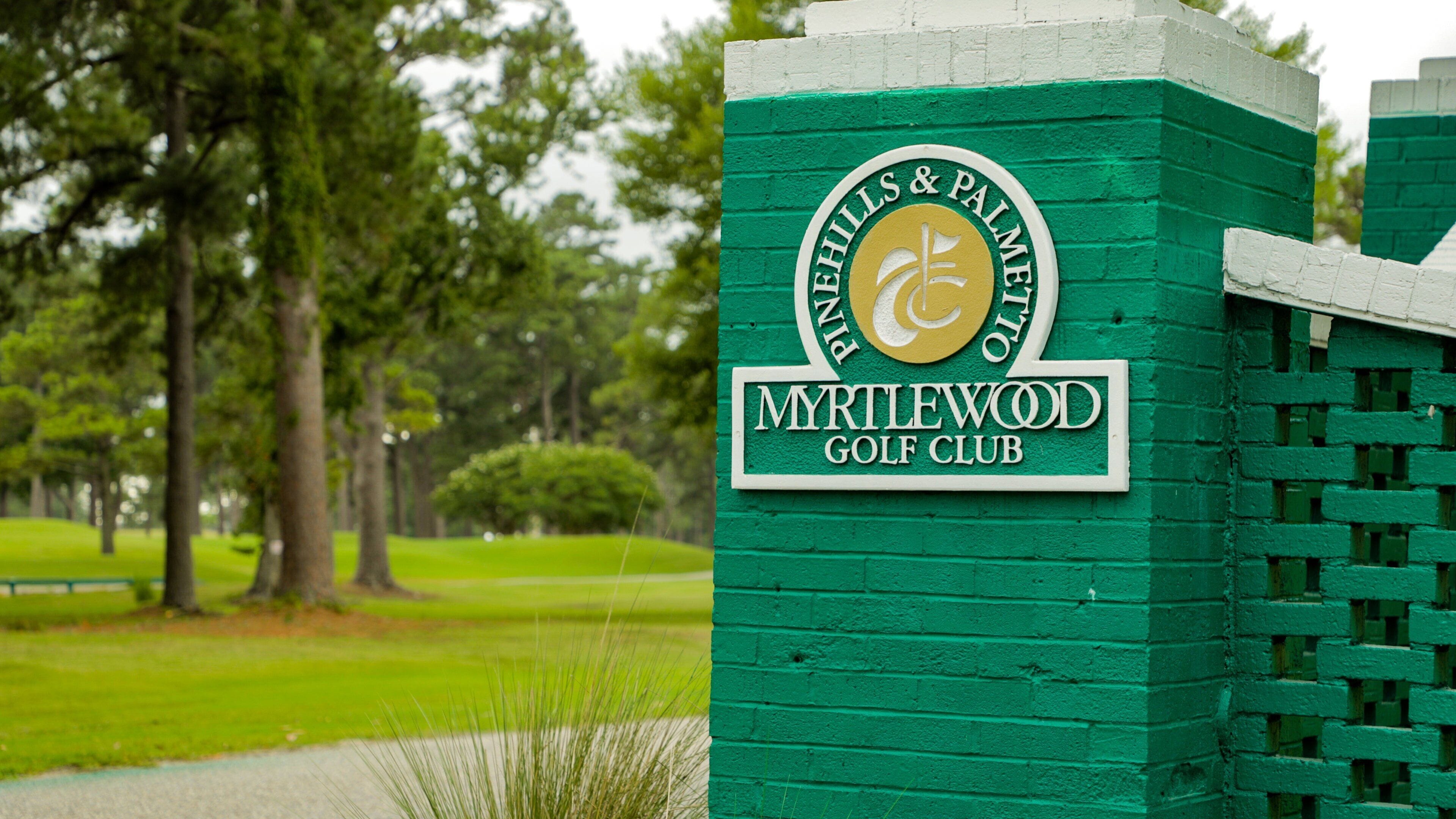 A green sign with the text "Pinnacles & Palmetto Golf Club" and "Myrtlewood Golf Club".