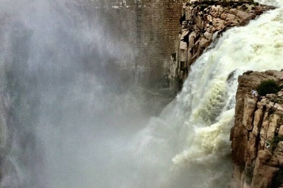 A large dam with a powerful waterfall.