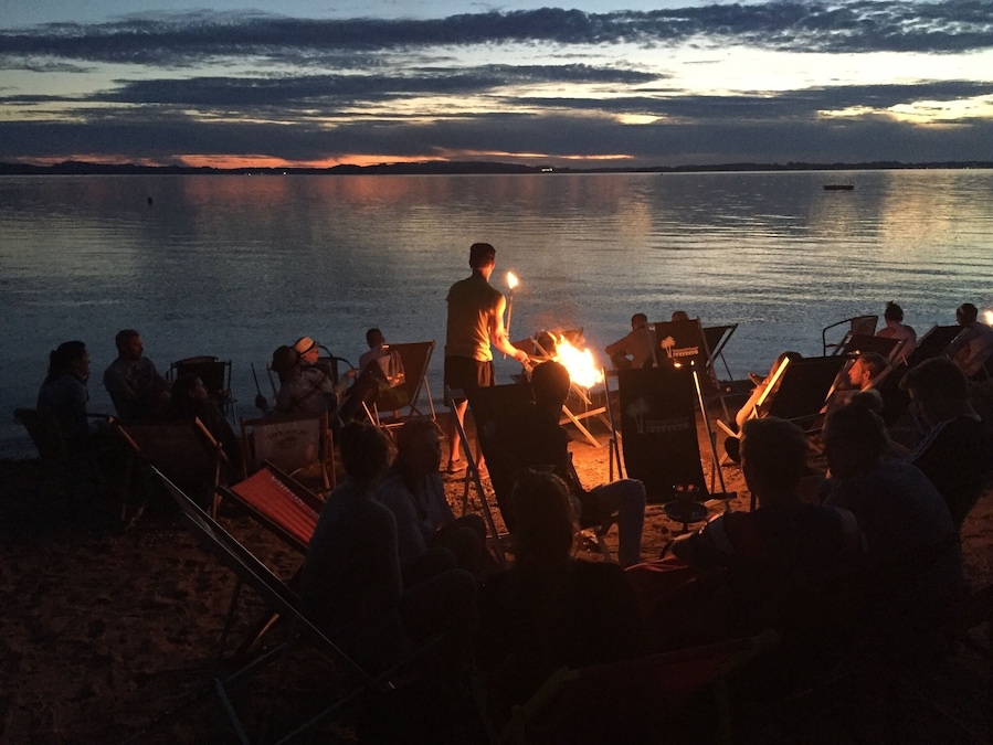 Chilling with friends, a cold drink in your hand, watching the sunset over the Chiemsee ( Bavaria, Germany). This evening could be worse 😉.
