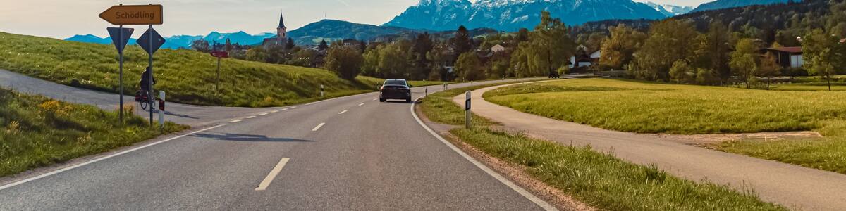 Alpine spring view with a church and the alps in the background near Teisendorf, Berchtesgadener Land, Bavaria, Germany