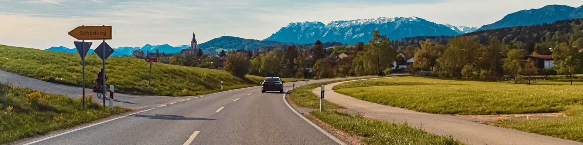 Alpine spring view with a church and the alps in the background near Teisendorf, Berchtesgadener Land, Bavaria, Germany