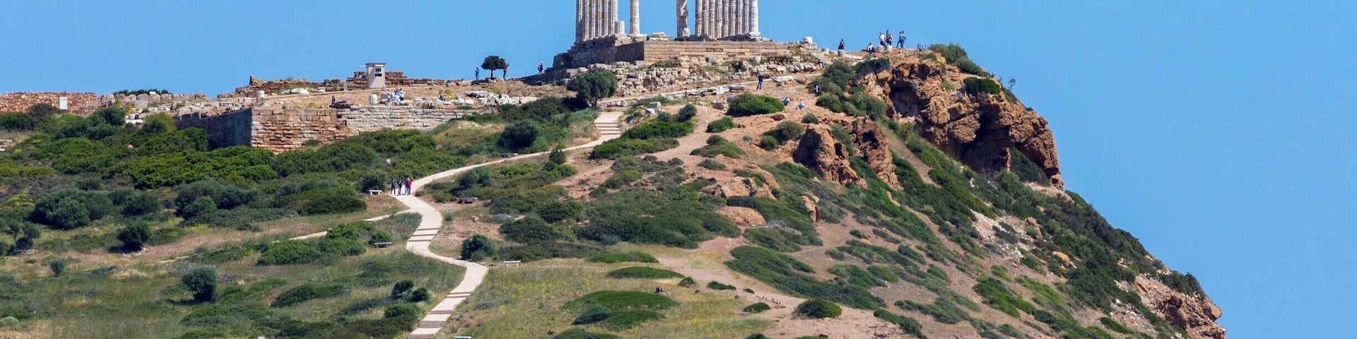 The ancient Temple of Poseidon in the distance standing guard over the vast Mediterranean Sea.
http://www.divebuddies4life.com/making-friends-with-poseidon/