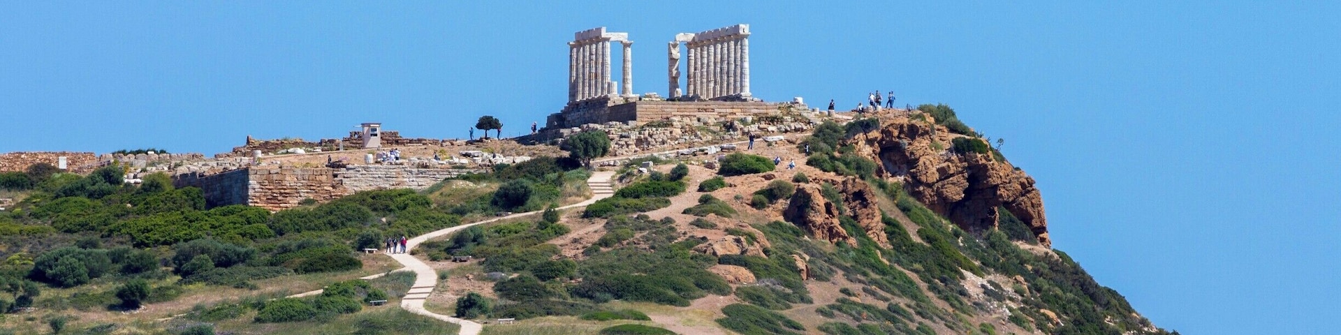 The ancient Temple of Poseidon in the distance standing guard over the vast Mediterranean Sea.
http://www.divebuddies4life.com/making-friends-with-poseidon/