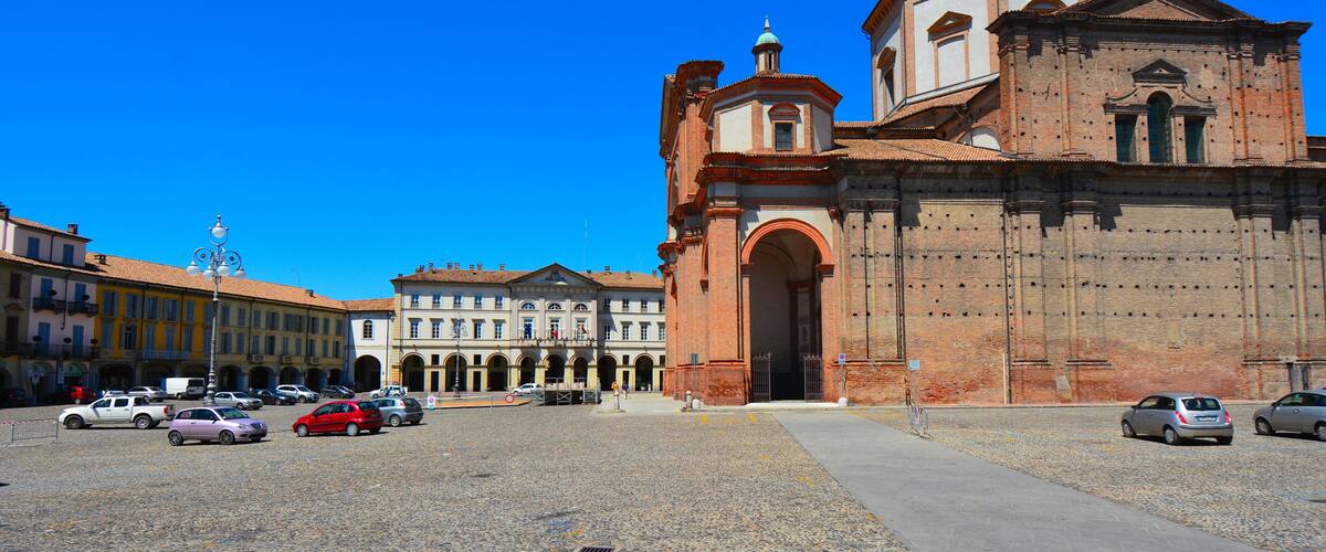 A historic church with a prominent archway and a tiled roof.