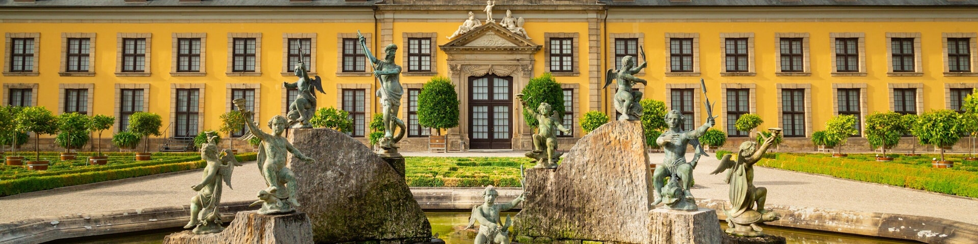 Herrenhausen Gardens which includes heritage architecture and a fountain