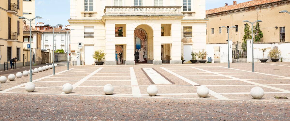 A classical building with a symmetrical facade, large windows, and a central entrance.