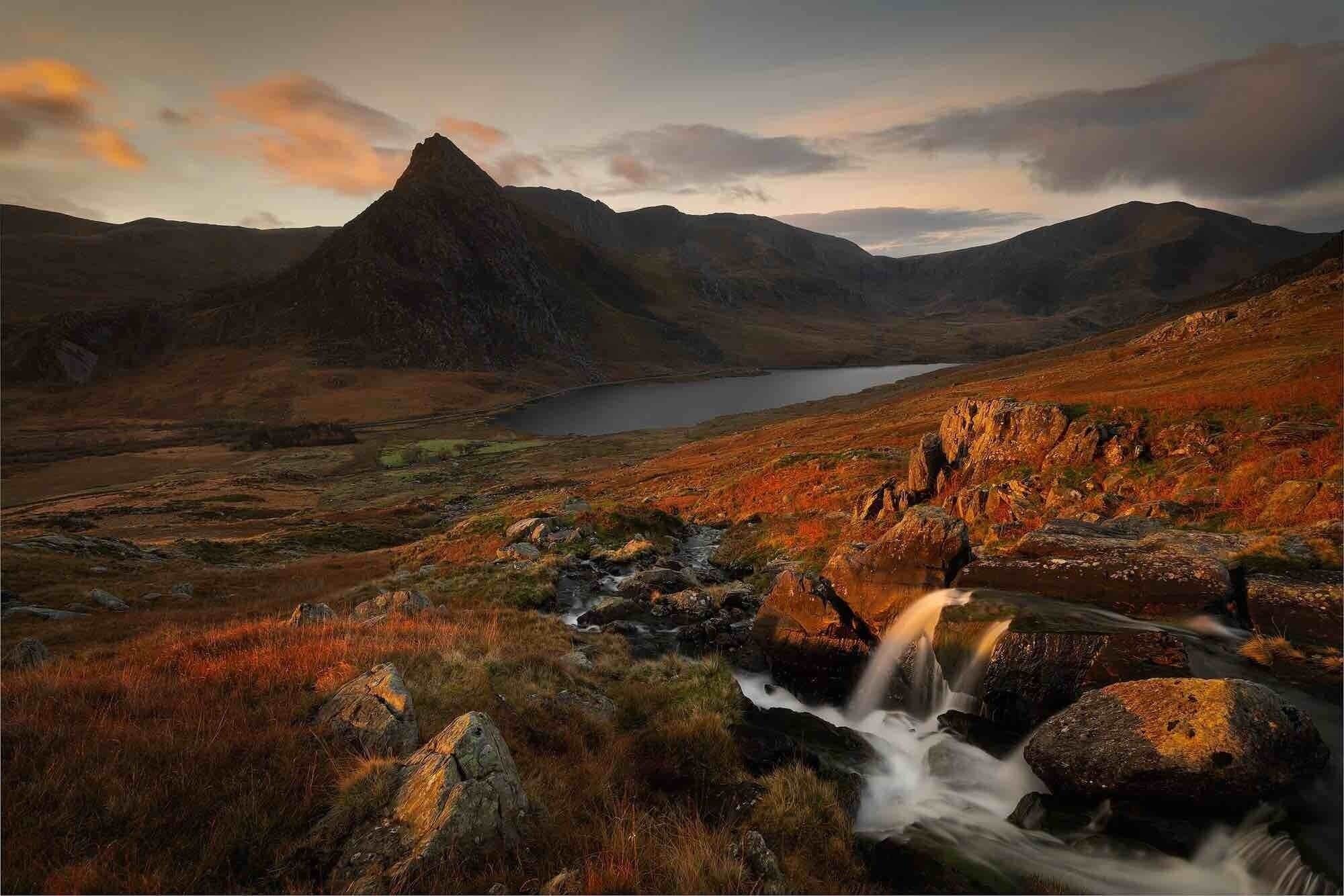 The waterfall runs down into Llyn Ogwen, with Tryfan in the. Background, taken at first light.