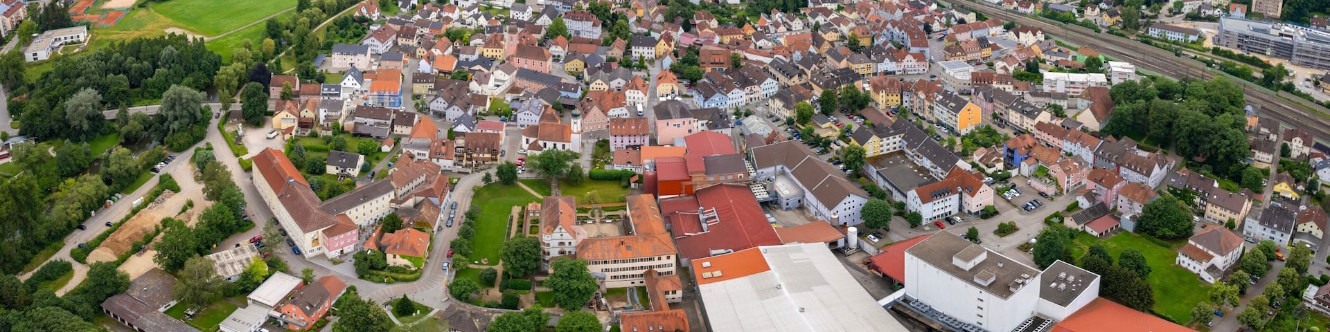 An aerial panorama view above the downtown in the city Treuchtlingen during a sunny summer day in Bavaria, Germany