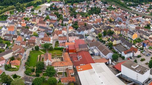 An aerial panorama view above the downtown in the city Treuchtlingen during a sunny summer day in Bavaria, Germany