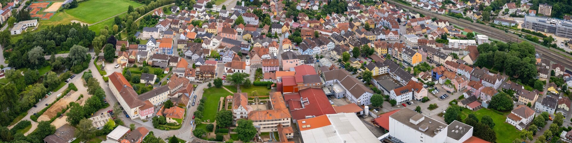 An aerial panorama view above the downtown in the city Treuchtlingen during a sunny summer day in Bavaria, Germany