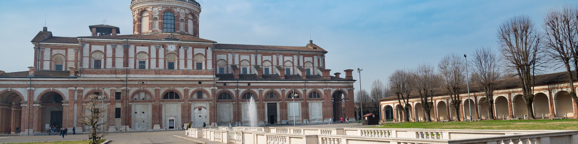 A large historic building with a prominent dome and arched windows.