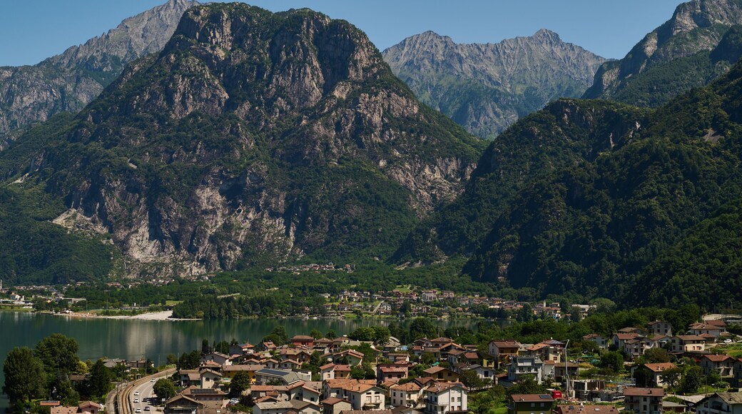 Aerial view of Verceia village on the shore of Lake Mezzola surrounded by the Italian Alps in Lombardy