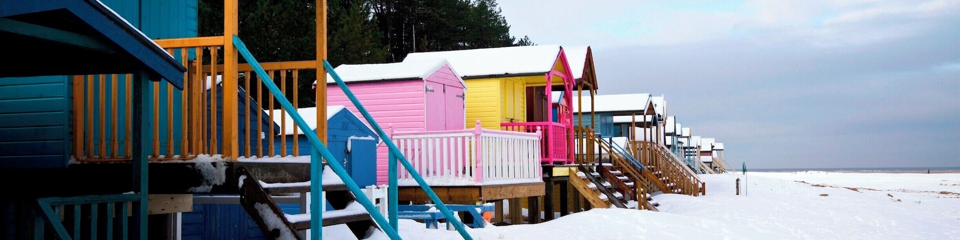 Snow covered Wells beach huts