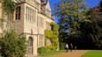 Anglesey Abbey showing heritage architecture and heritage elements as well as a family