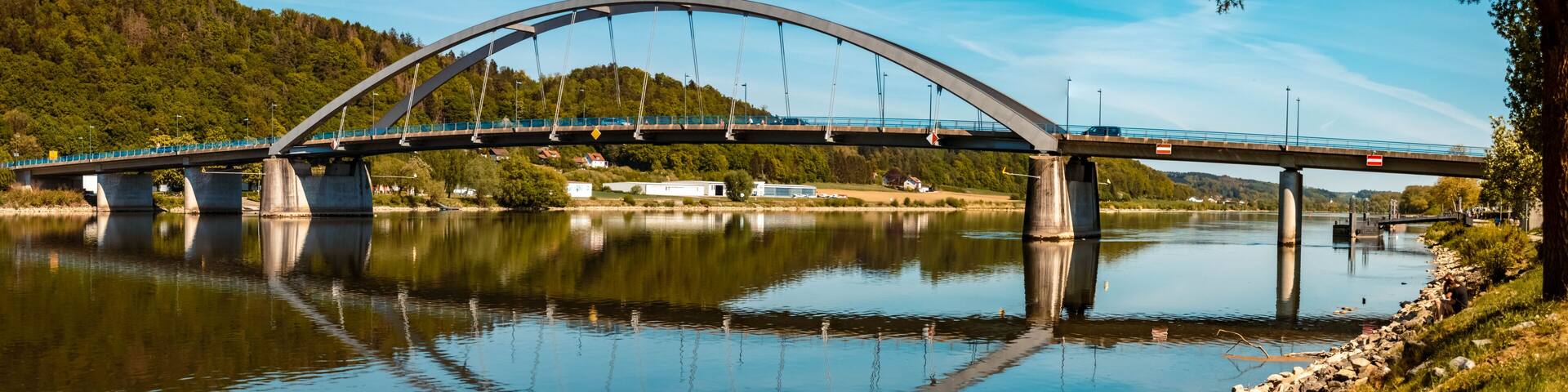 High resolution stitched panorama of a beautiful spring view with reflections and a bridge at Vilshofen, Danube, Bavaria, Germany