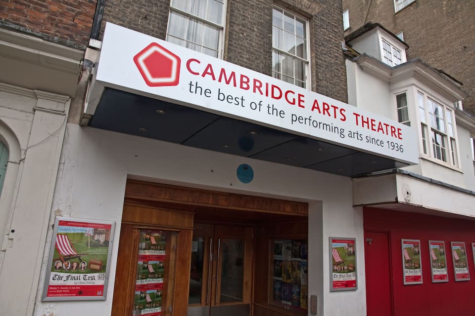 A building with a sign that reads "CAMBRIDGE ARTS THEATRE".