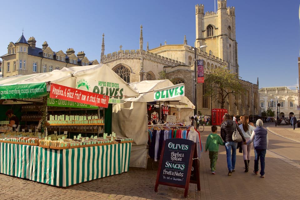 A street market with stalls selling olives, herbs, and spices.