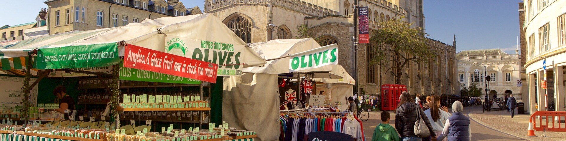 Cambridge Market Square showing markets as well as a family