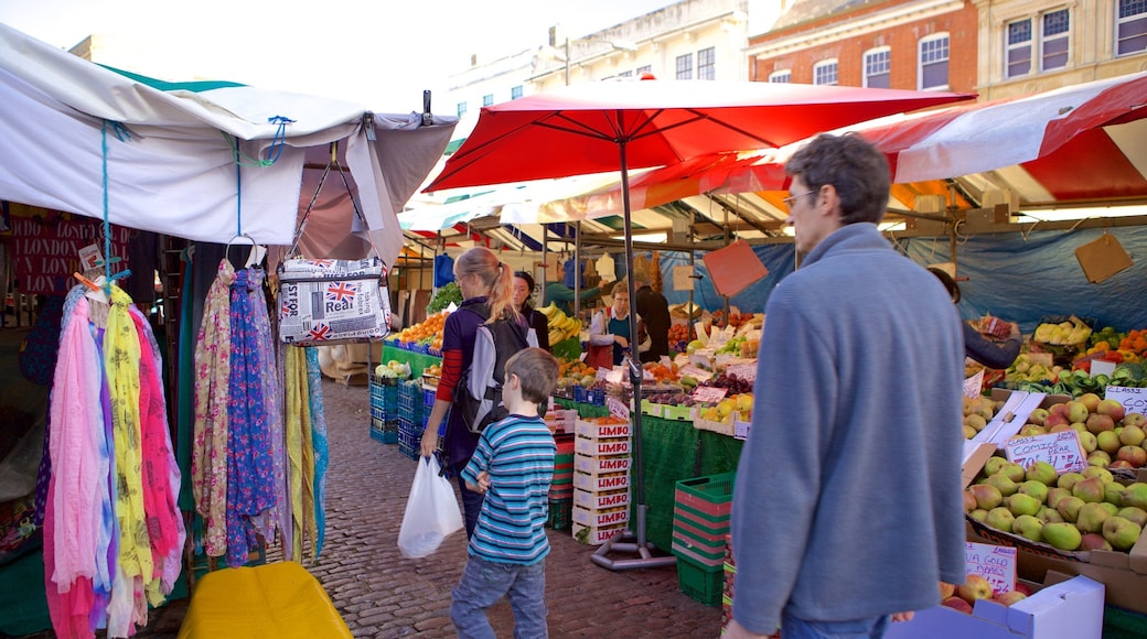 Cambridge Market Square featuring markets as well as a family
