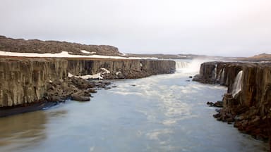 Skinnastadur featuring a gorge or canyon, a cascade and a river or creek