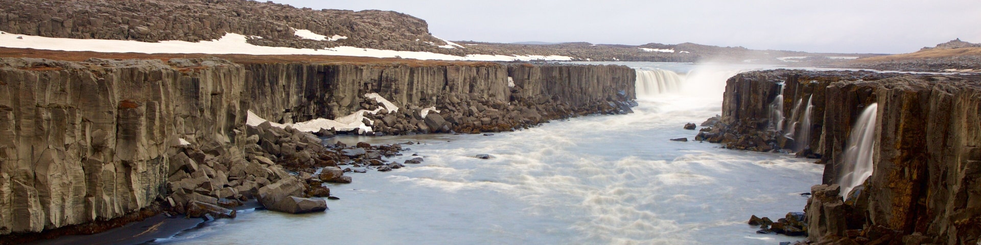 Skinnastadur featuring a gorge or canyon, a cascade and a river or creek