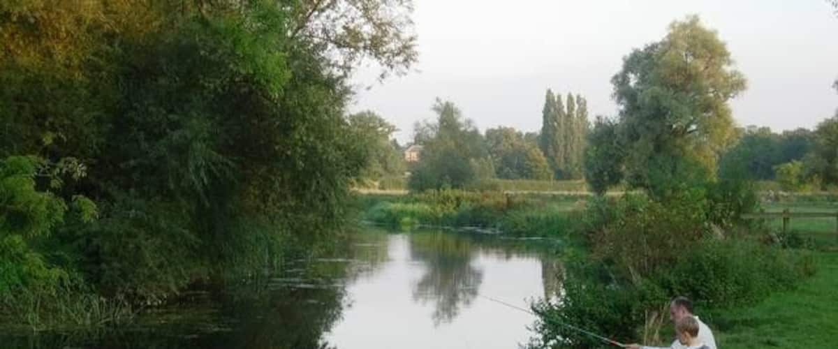 Fishing the Cam A child with (presumably) his grandfather enjoying a pleasant evening by the Cam.