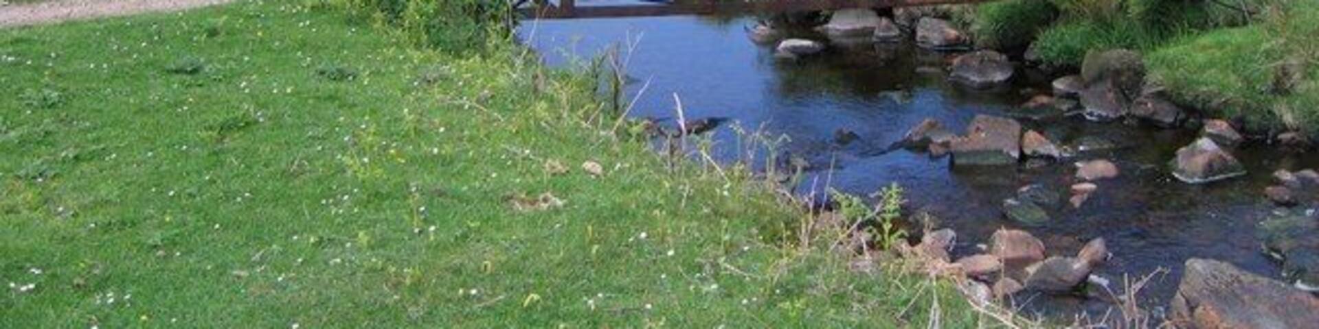 Cnocbreac The bridge at Cnocbreac with the fishing loch of Loch a' Chnuic Bhric just visible.