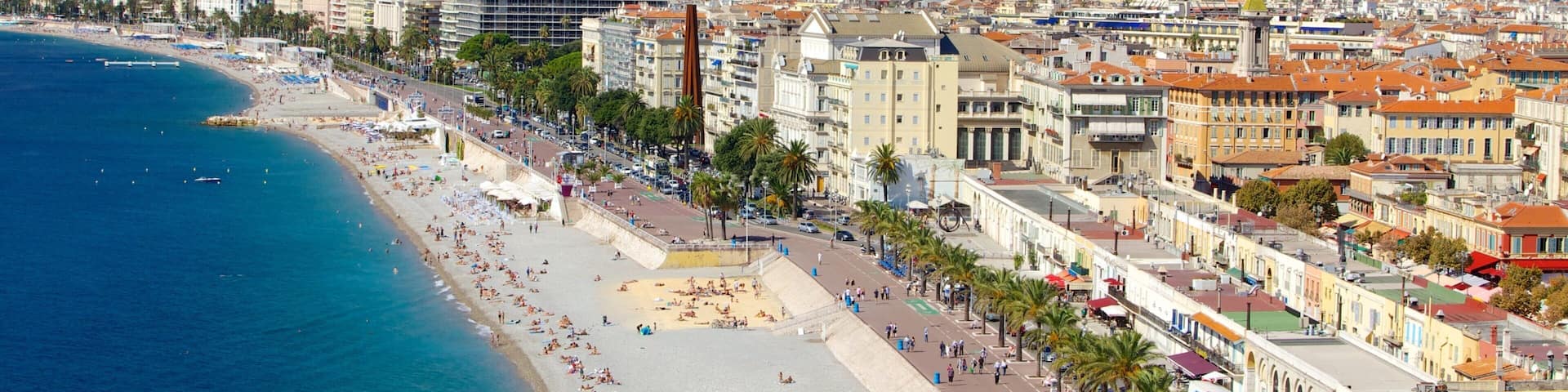 Nice showing tropical scenes, a beach and a coastal town