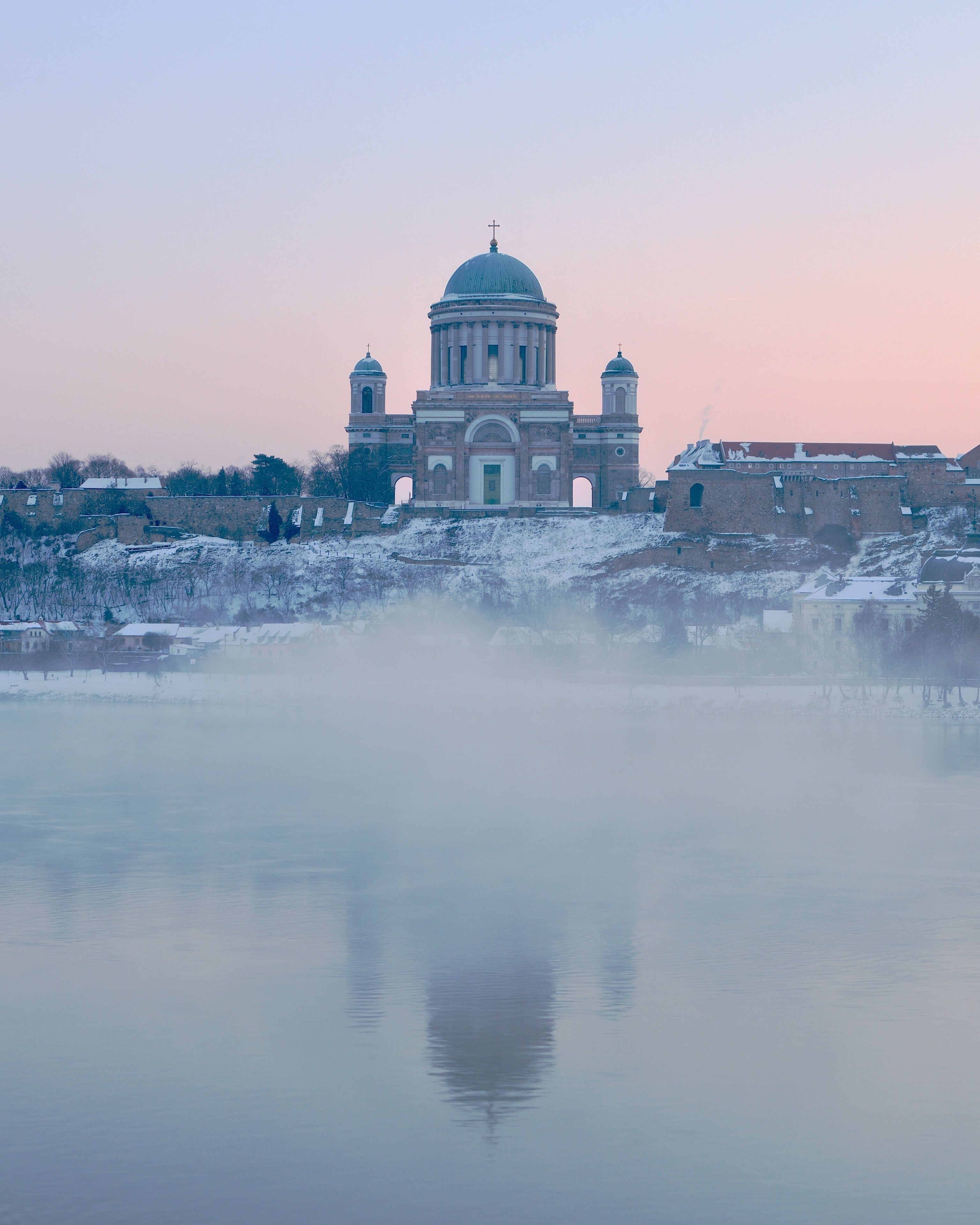 The Esztergom Basilica in Hungary taken at sunrise on a cold winter morning from the Slovakian half of the Mária Valéria bridge.