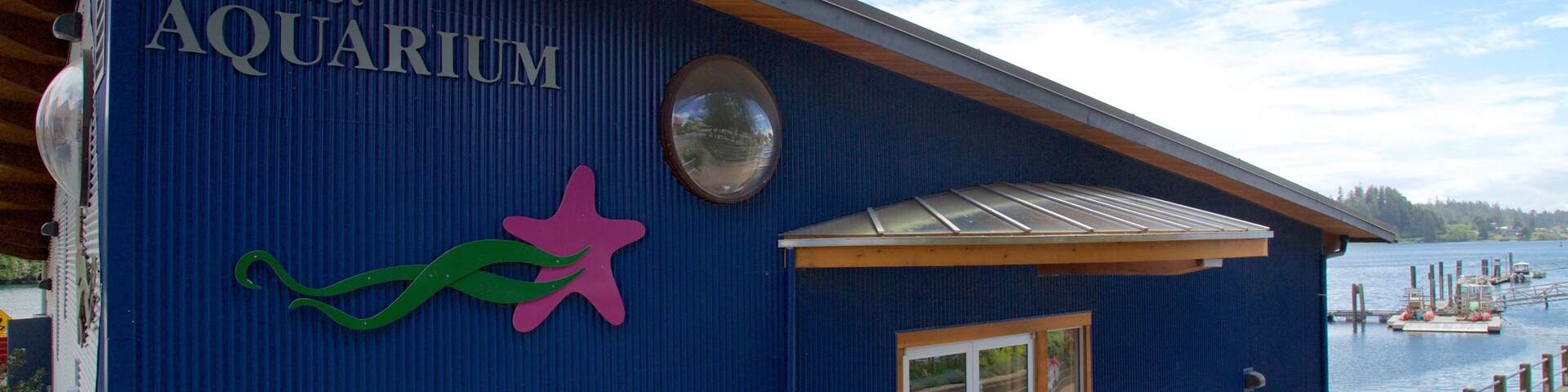 Ucluelet Aquarium featuring a bay or harbor and signage