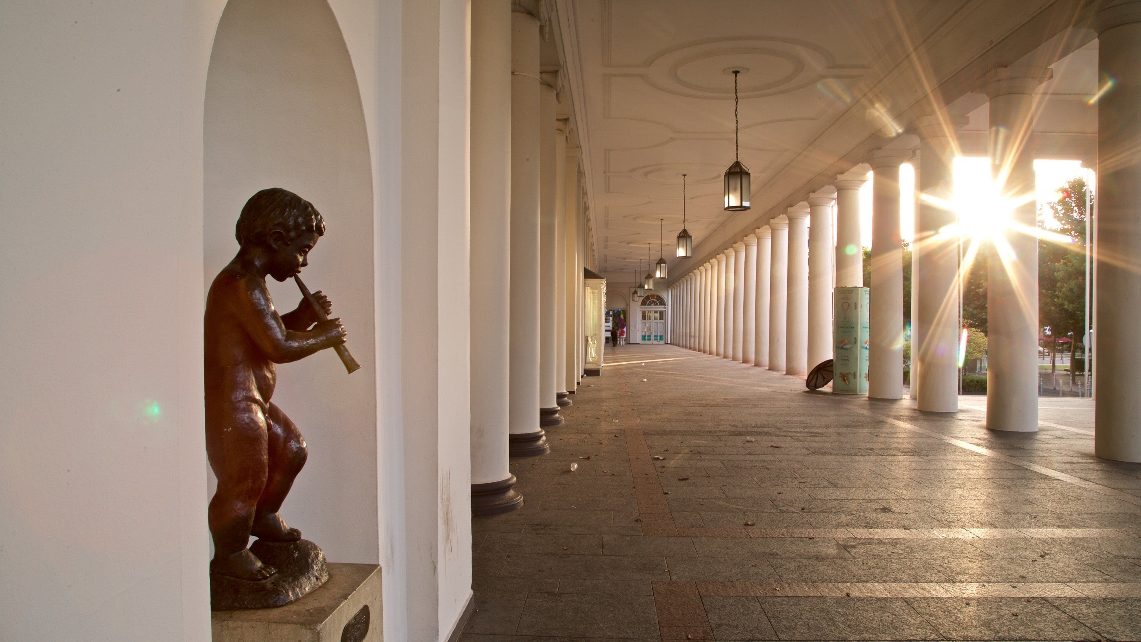Hessian State Theatre which includes a statue or sculpture and a sunset