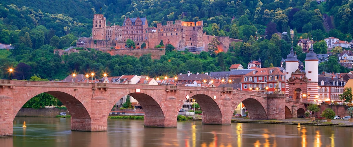 Karl Theodor Bridge which includes a city, night scenes and heritage elements