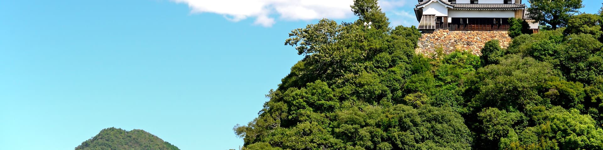 Inuyama castle under the blue sky in Inuyama city, Japan; Shutterstock ID 555947974
