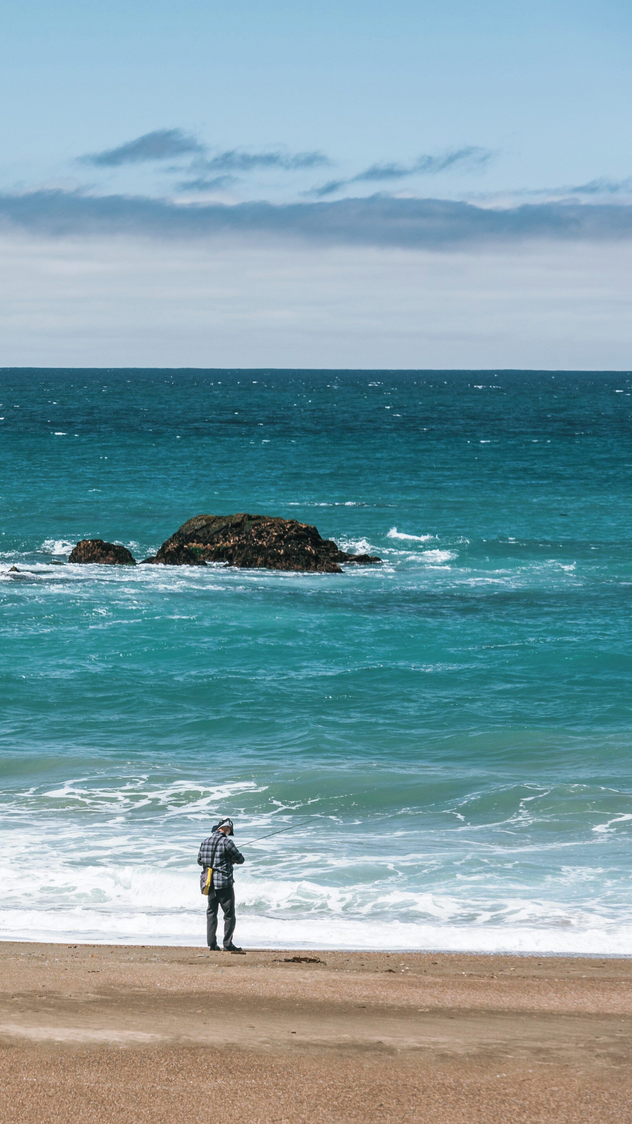 Exploring the serene waters of Moonstone Beach Park in Cambria, California on a clear day