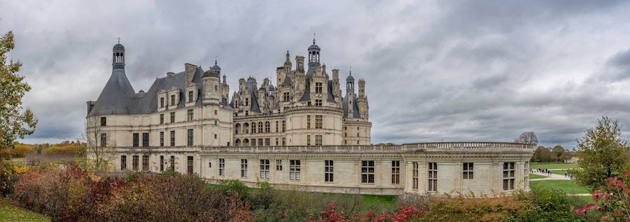 Chambord, France - 10 27 2025: Panoramic view of the Chambord Castle building with balconies, towers, bell towers and chimneys
