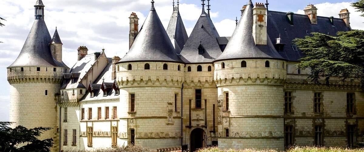 Château de Chaumont appears as if it's straight from the page of a fairy tale. This multi-towered and turreted fortress-like château was founded in the year 1000, rebuilt by King Louis XI around 1465 and acquired by Catherine de Médicis in 1550. The château's apartments, including the Catherine de Médicis room, are beautifully appointed with historic tapestries and works of art. Many of the rooms have been recently embellished with renovated furnishings and decor, allowing visitors to appreciate the château in all its original glory. Both the château and its English-style gardens are open to the public. Adding to its tourist appeal, the Domaine de Chaumont-sur-Loire presents contemporary "Art Season" exhibits, changing annually to showcase the work of emerging artists, with artworks, sculptures, and creative installations displayed throughout the château and gardens. The château also hosts the "Festival International des Jardins," a garden design festival that draws inspiration from concepts in literature and poetry.