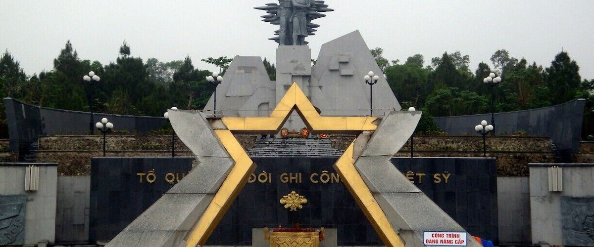 A monument with a star-shaped base and a statue on top.