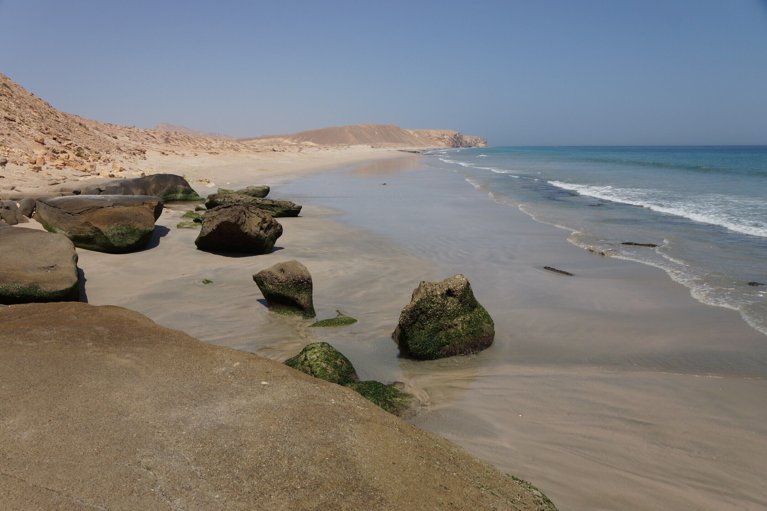 Continue walking down the beach, and there are cliffs that have been shaped by the elements.  These are less accessible during high tide.